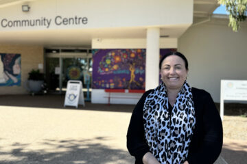 Deputy CEO Nerissa Wade standing in front of Hervey Bay Neighbourhood Centre