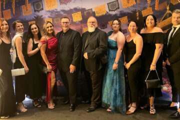 inCommunity Connect and Tenancy Skills Institute team members standing together at the REIQ Awards